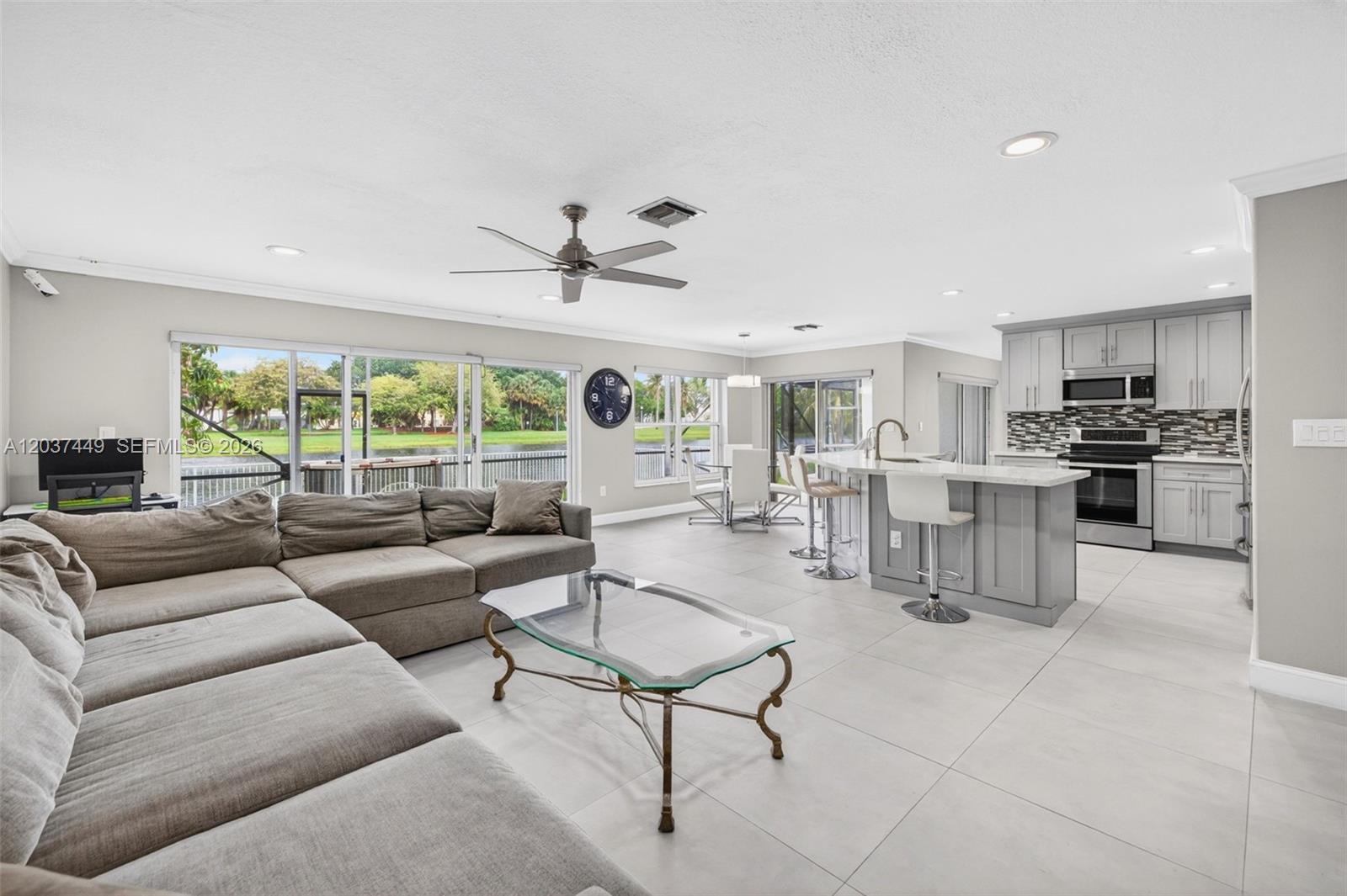 17488 Southwest 28th Court Miramar, FL 33029 - Photo 11 of 50 a living room with furniture and a large window