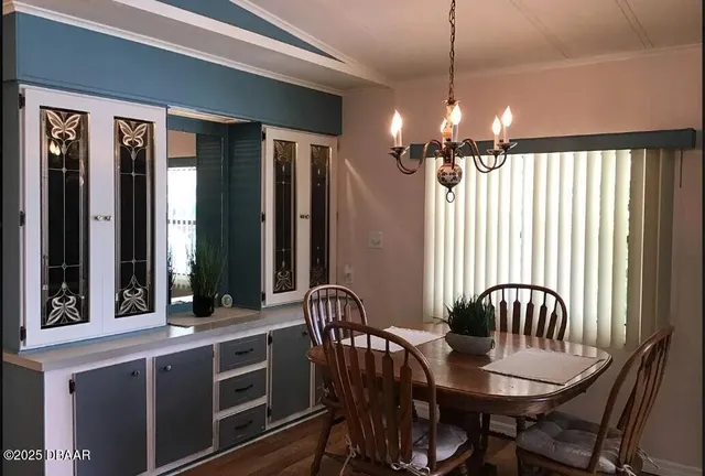 a view of a dining room with furniture window and outdoor view