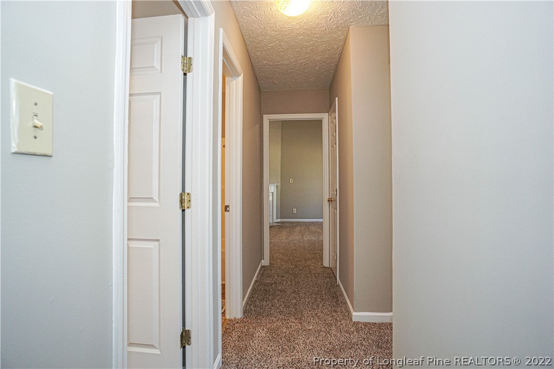 5094 Summer Ridge Road Fayetteville, NC 28303 - Photo 15 of 30 a view of a hallway with two rooms