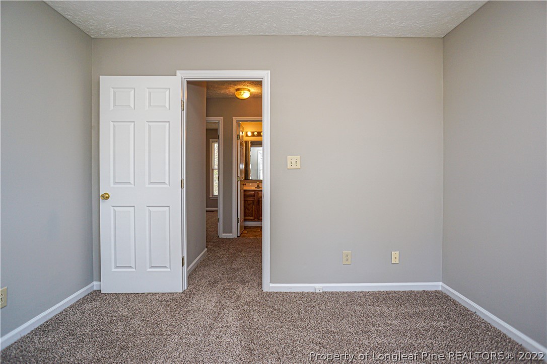 5094 Summer Ridge Road Fayetteville, NC 28303 - Photo 18 of 30 an empty room with closet area