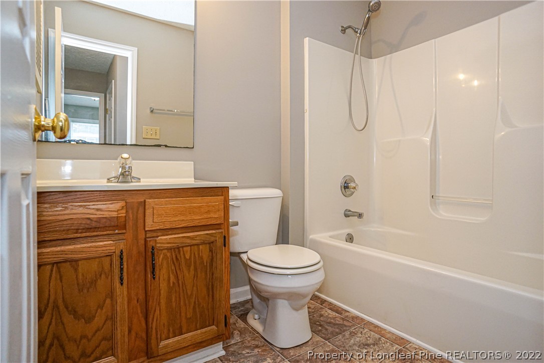 5094 Summer Ridge Road Fayetteville, NC 28303 - Photo 20 of 30 a bathroom with a sink toilet and shower