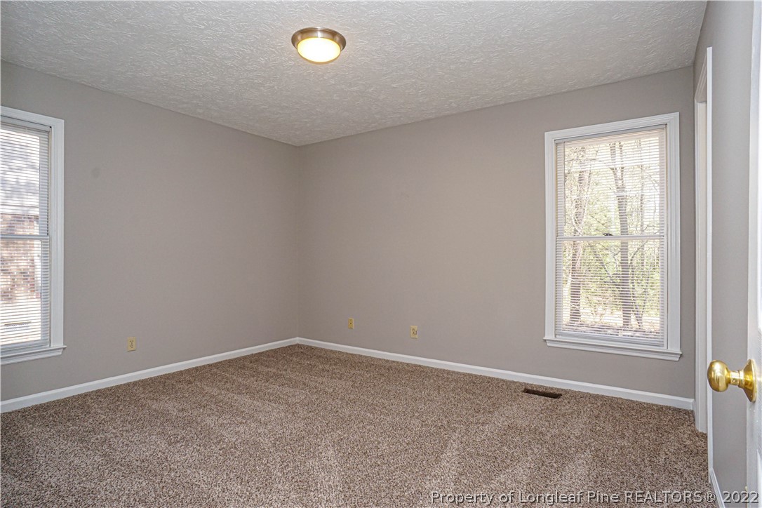 5094 Summer Ridge Road Fayetteville, NC 28303 - Photo 25 of 30 an empty room with windows