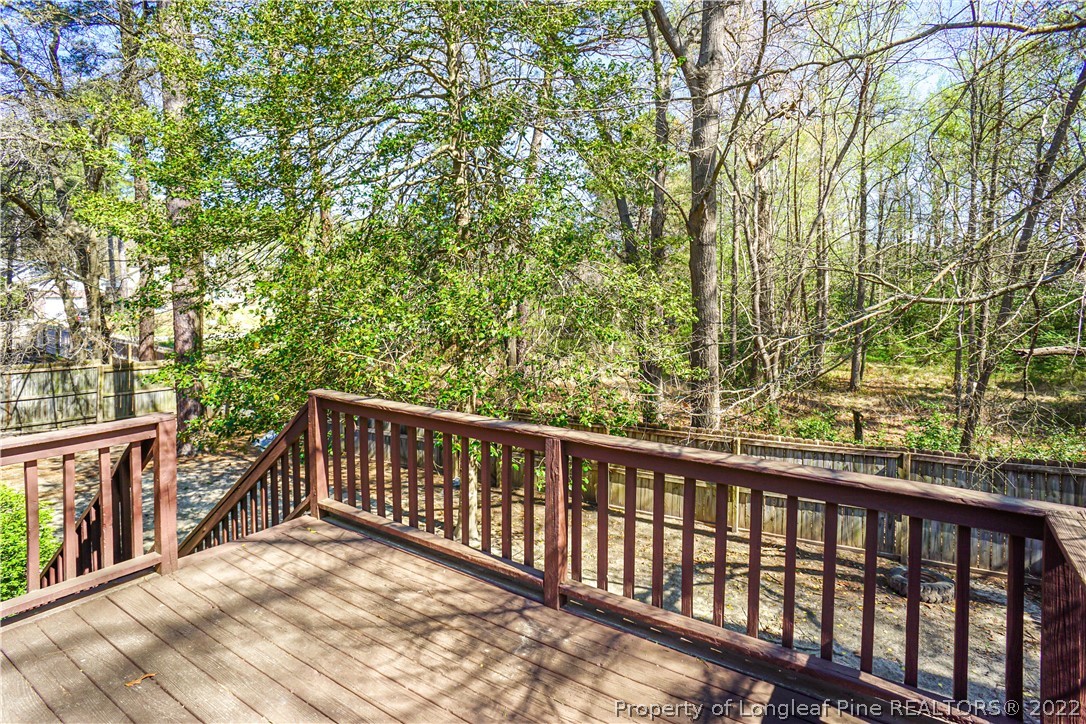 5094 Summer Ridge Road Fayetteville, NC 28303 - Photo 28 of 30 a balcony with wooden floor and fence