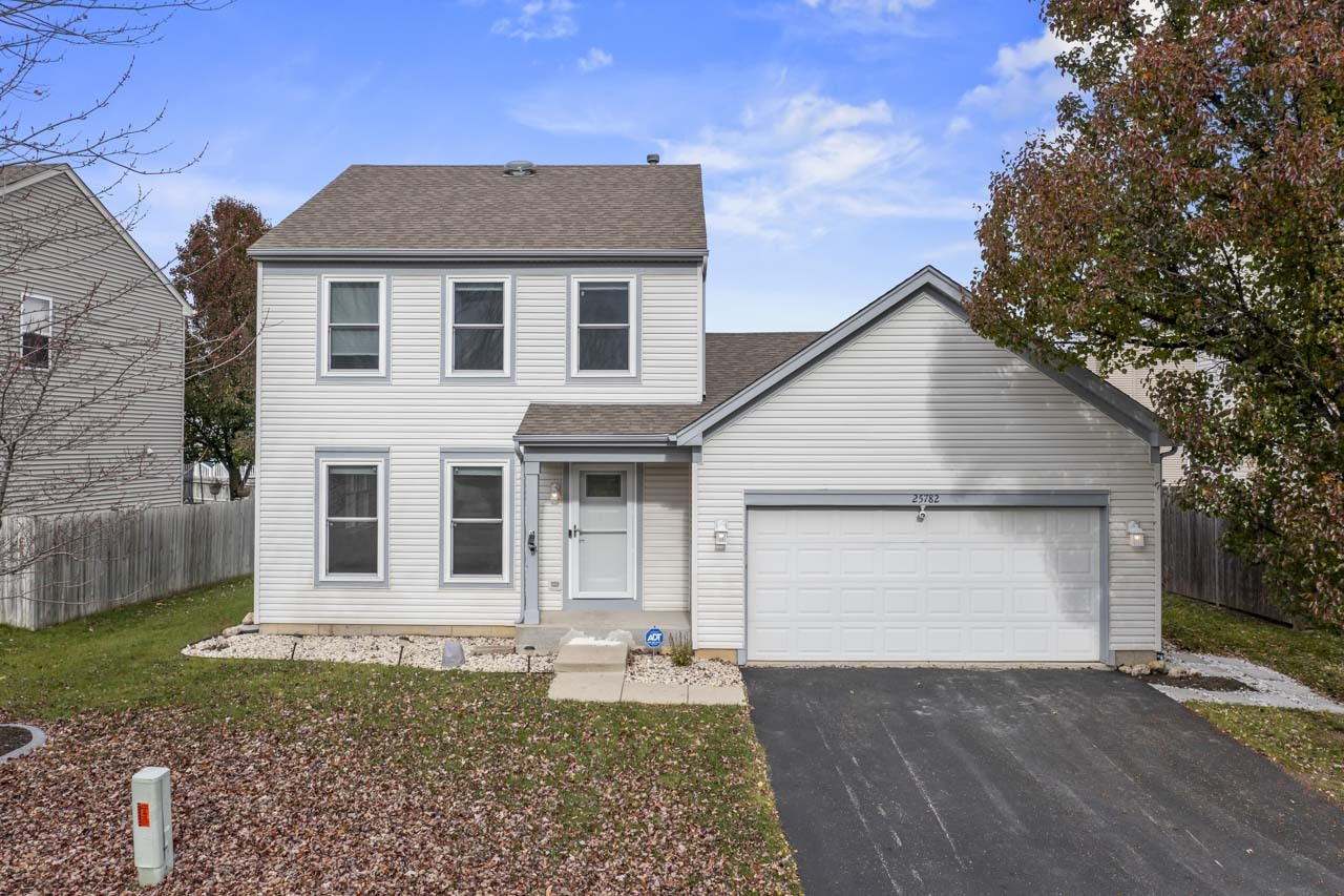 25782 West Prairieview Road Round Lake, IL 60073 - Photo 1 of 34 a front view of a house with a yard