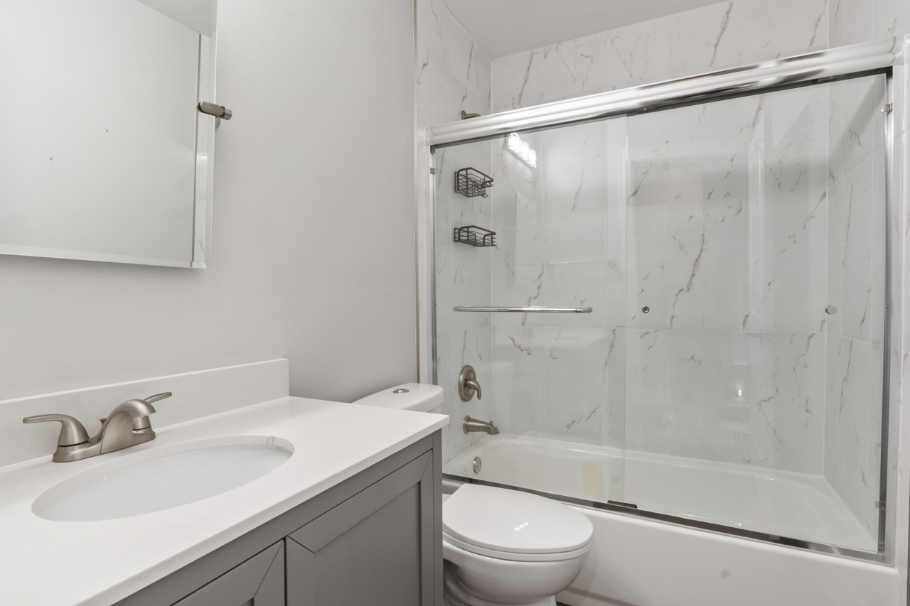 25782 West Prairieview Road Round Lake, IL 60073 - Photo 20 of 34 a bathroom with a bathtub shower sink vanity and toilet