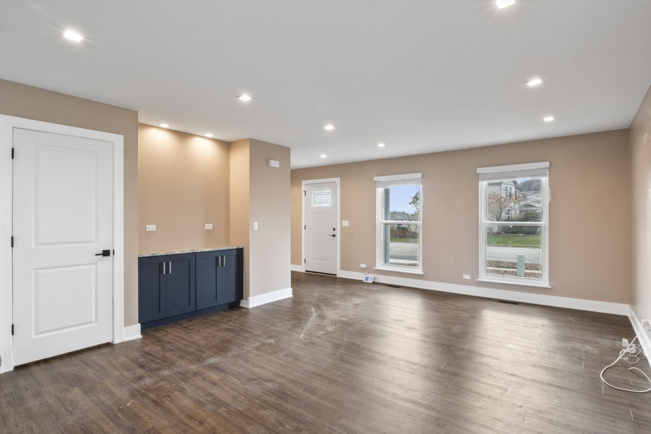 25782 West Prairieview Road Round Lake, IL 60073 - Photo 2 of 34 a view of an empty room with wooden floor and a window