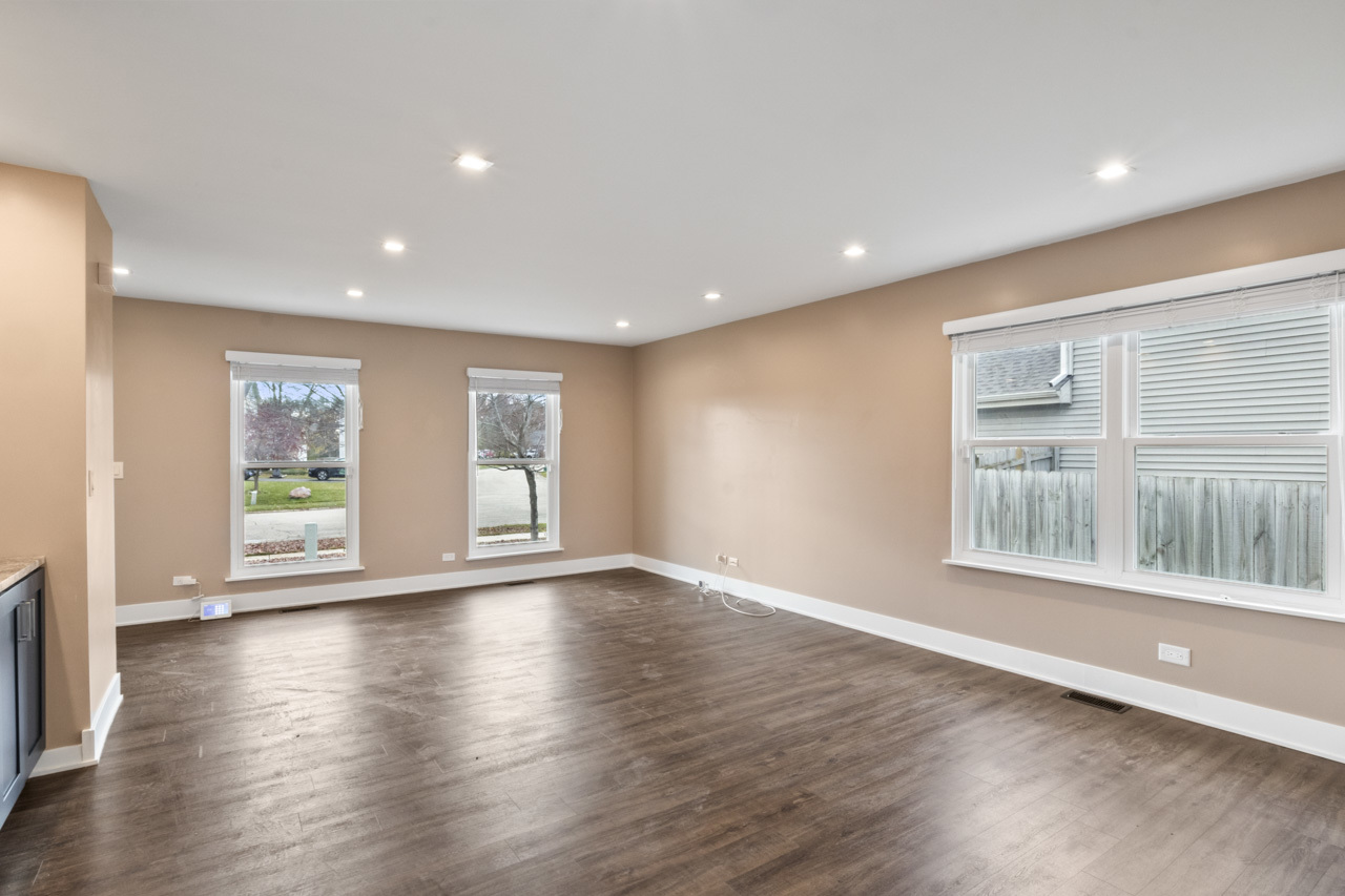 25782 West Prairieview Road Round Lake, IL 60073 - Photo 3 of 34 a view of an empty room with wooden floor and a window