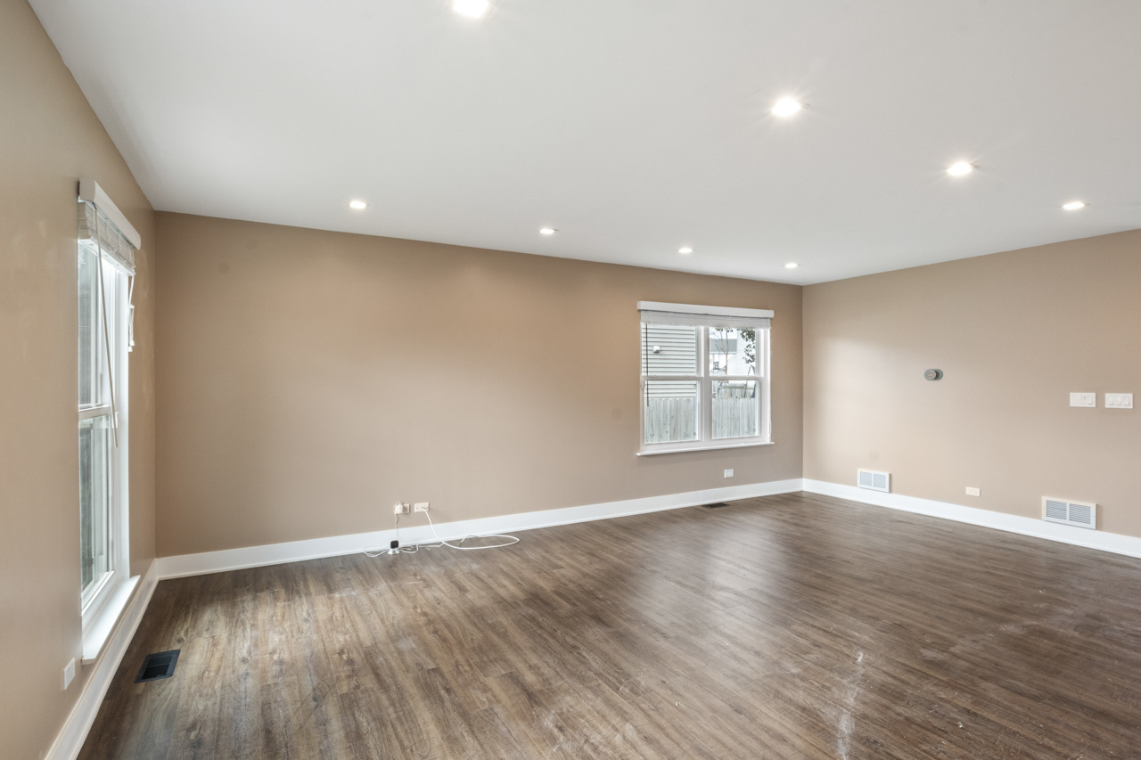 25782 West Prairieview Road Round Lake, IL 60073 - Photo 4 of 34 an empty room with wooden floor and window