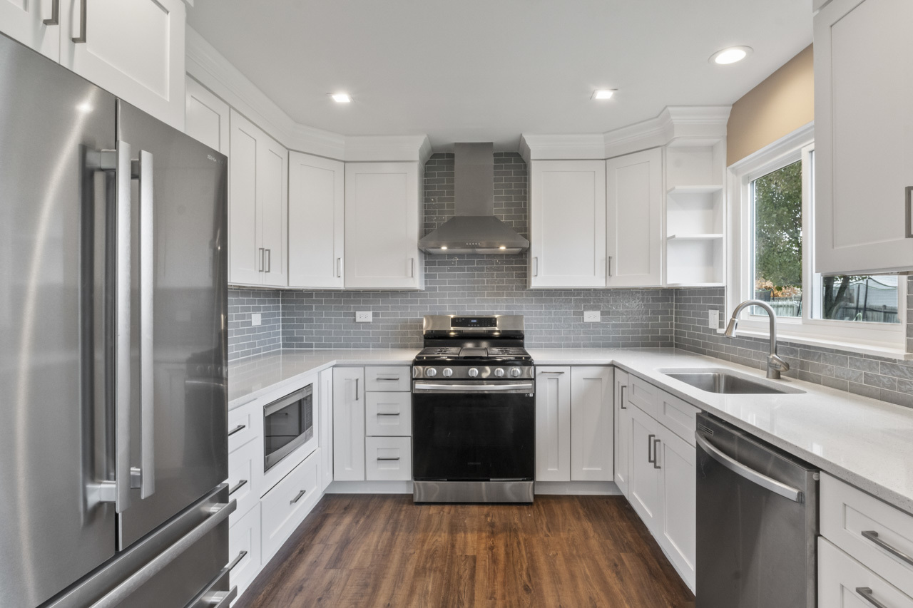 25782 West Prairieview Road Round Lake, IL 60073 - Photo 8 of 34 a kitchen with stainless steel appliances granite countertop a stove a sink and a refrigerator