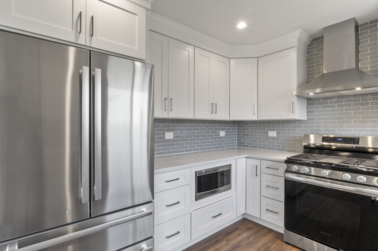 25782 West Prairieview Road Round Lake, IL 60073 - Photo 9 of 34 a kitchen with stainless steel appliances white cabinets and a stove