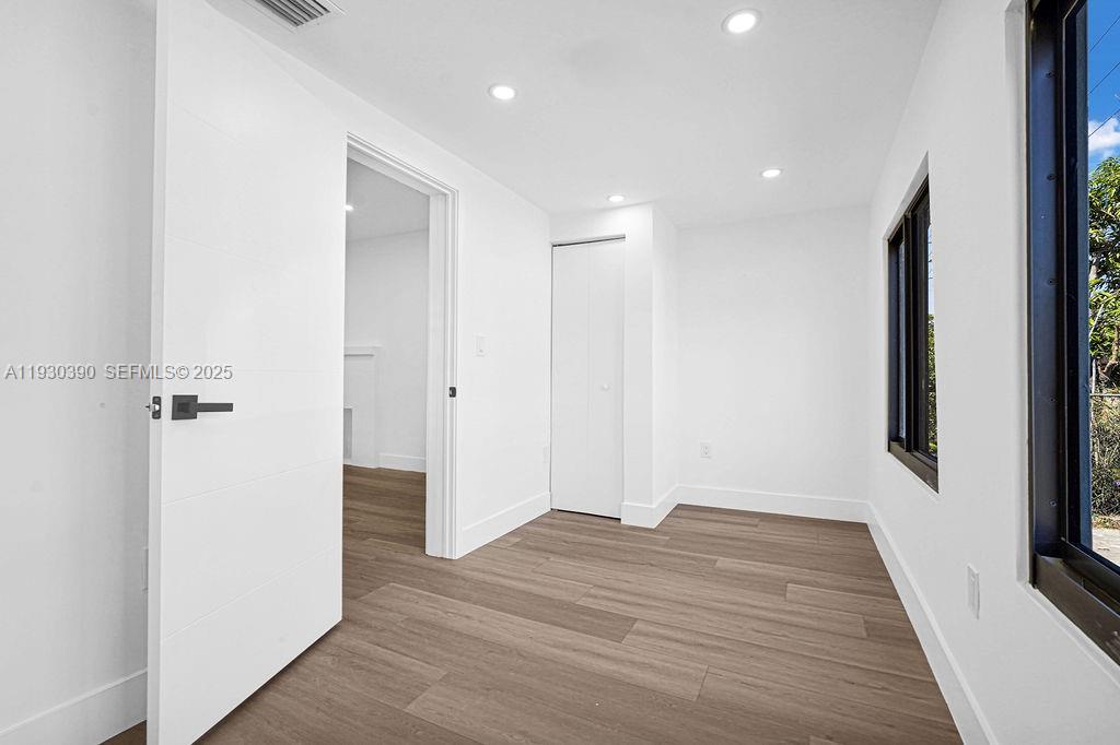 3040 Northwest 13th Avenue Miami, FL 33142 - Photo 33 of 46 a view of hallway with wooden floor