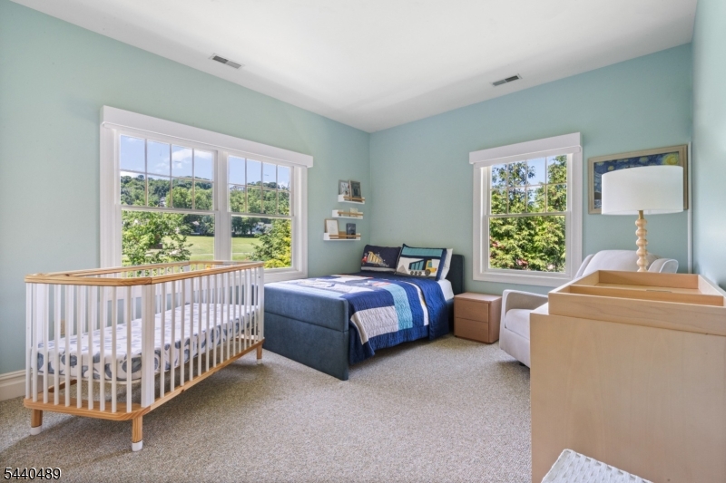 99 East Lindsley Road Cedar Grove, NJ 07009 - Photo 30 of 41 a bed room with a bed and a window