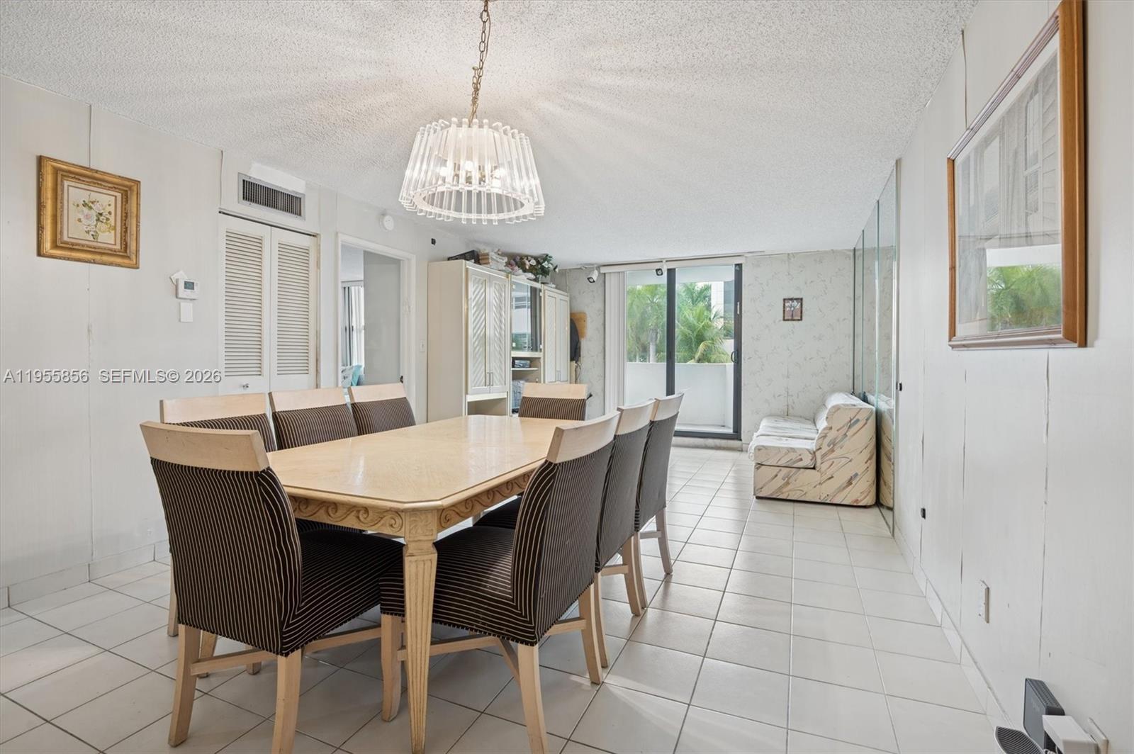 4301 Collins Avenue, Unit 202 Miami Beach, FL 33140 - Photo 4 of 12 a view of a dining room with furniture window and outside view