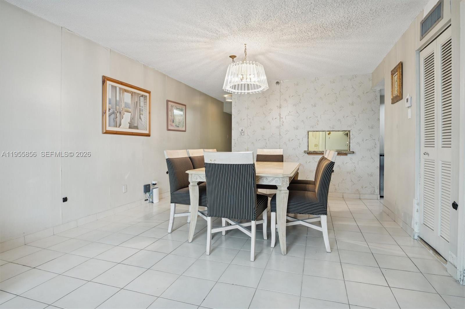 4301 Collins Avenue, Unit 202 Miami Beach, FL 33140 - Photo 5 of 12 a view of a dining room with furniture
