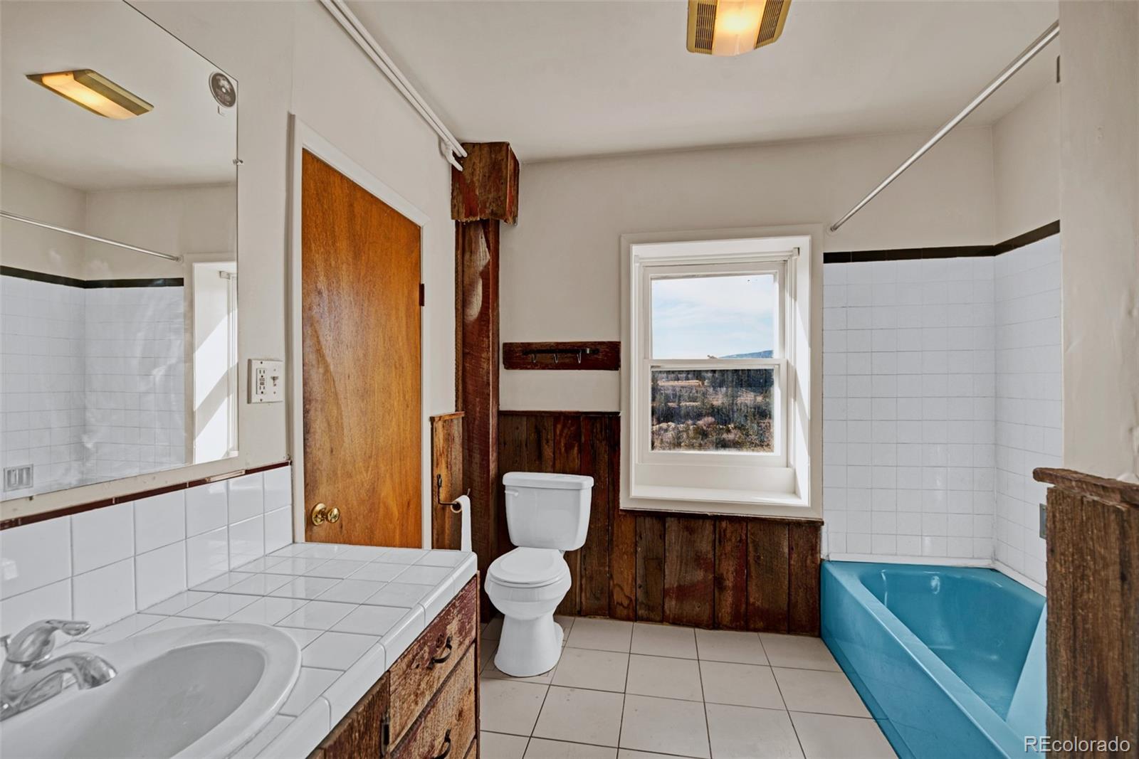 711 Front Street Fairplay, CO 80440 - Photo 17 of 40 a bathroom with a sink a toilet and shower