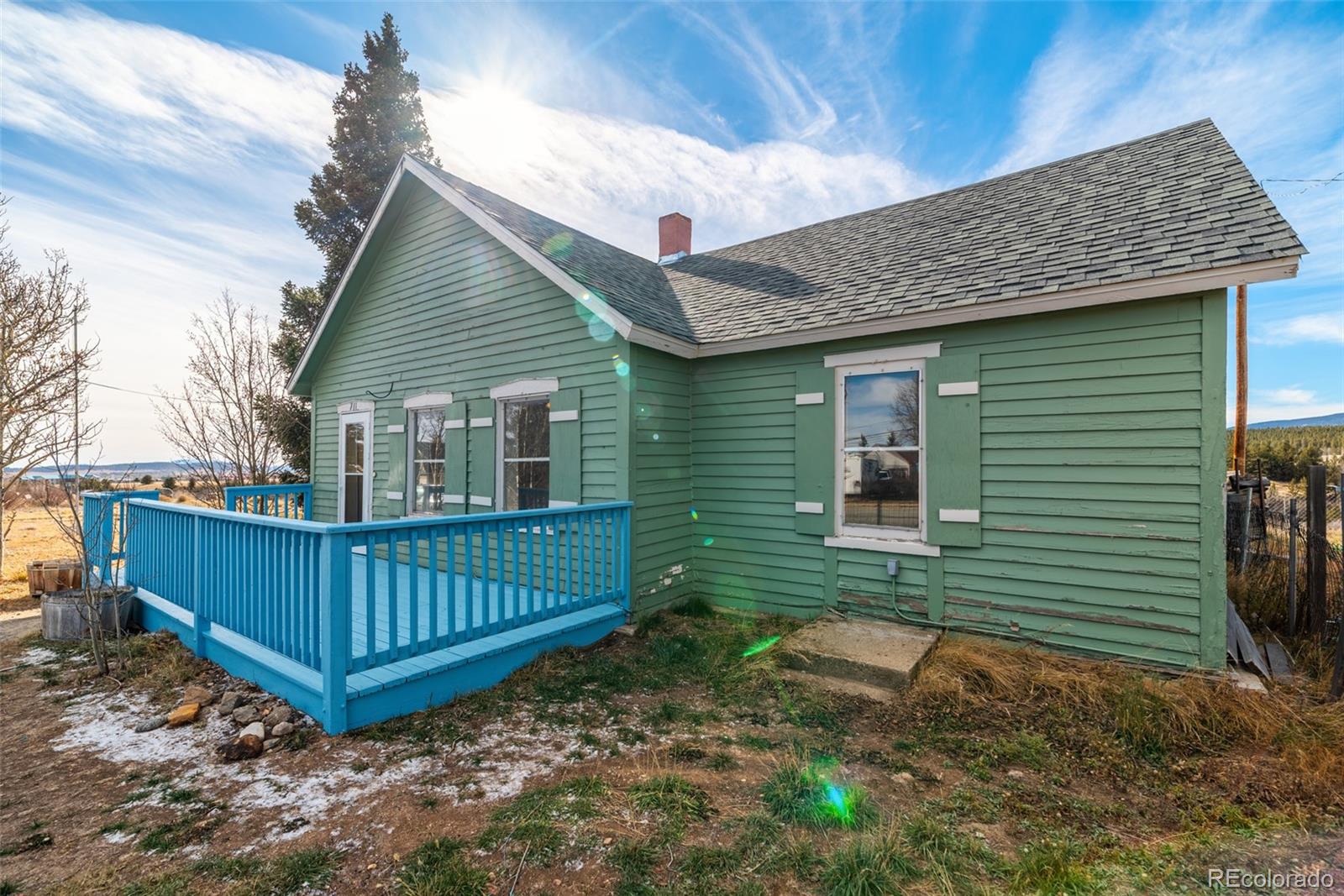 711 Front Street Fairplay, CO 80440 - Photo 2 of 40 a front view of a house with garden