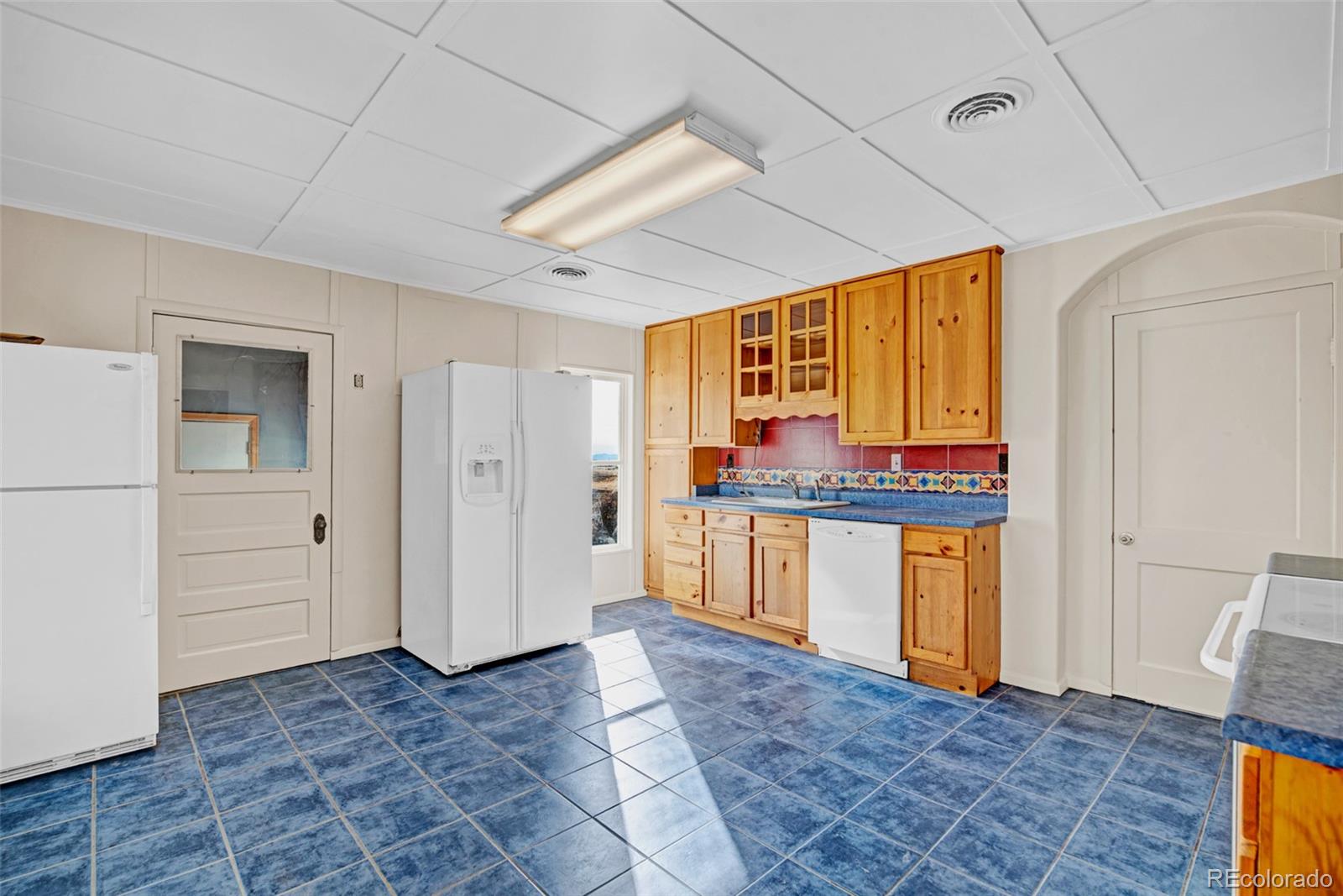 711 Front Street Fairplay, CO 80440 - Photo 6 of 40 a view of a kitchen with refrigerator and window