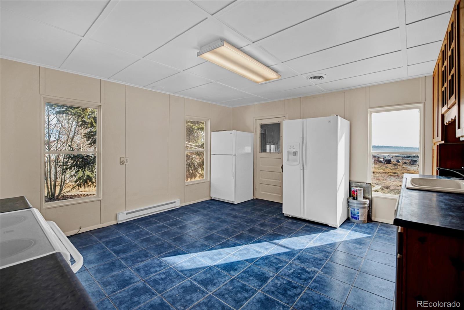 711 Front Street Fairplay, CO 80440 - Photo 7 of 40 a view of a kitchen with furniture and wooden floor