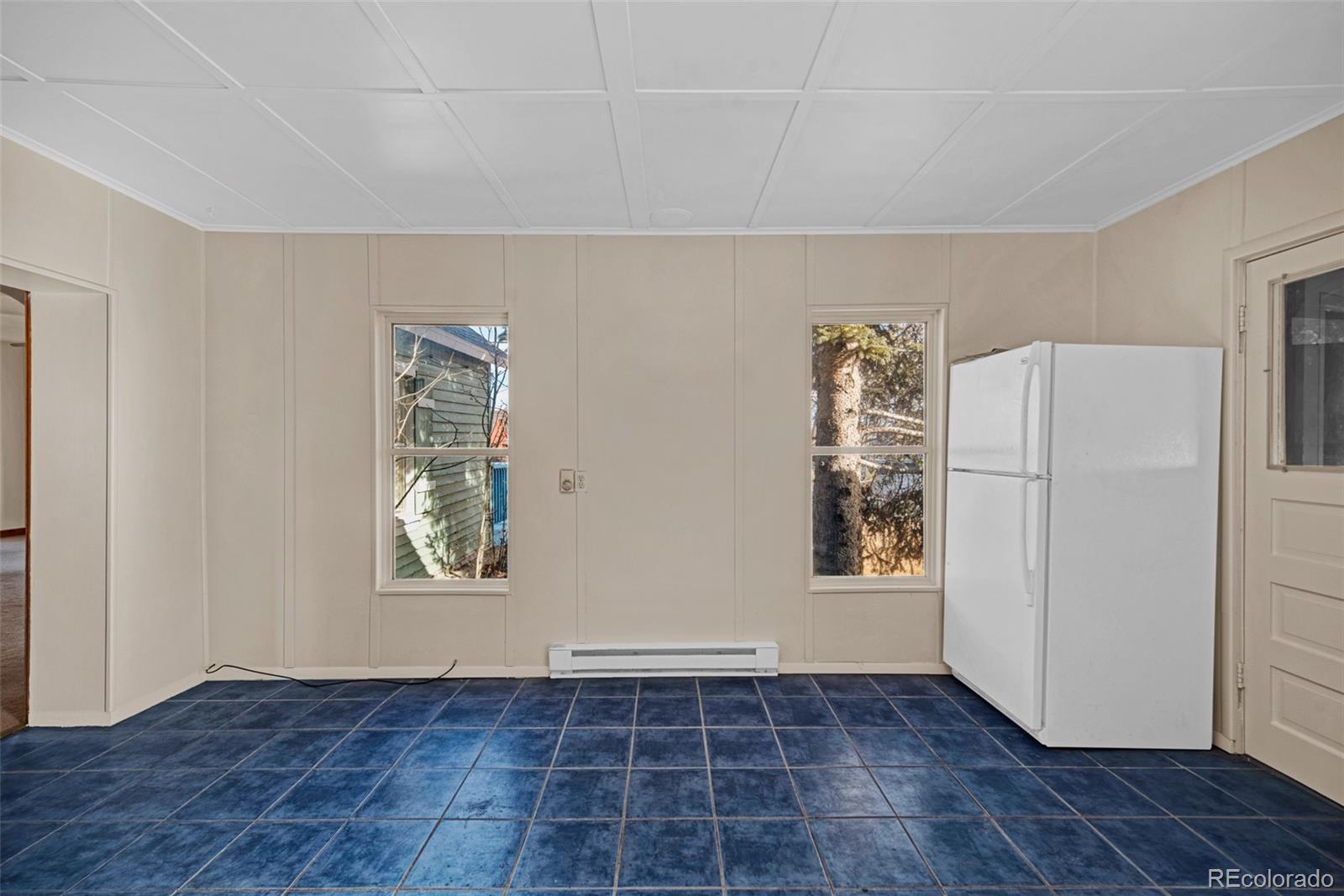 711 Front Street Fairplay, CO 80440 - Photo 8 of 40 a view of an empty room with wooden floor and a window