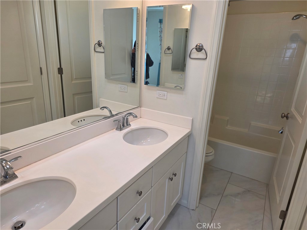 116 Firefly Irvine, CA 92618 - Photo 13 of 16 a bathroom with a sink and a tub