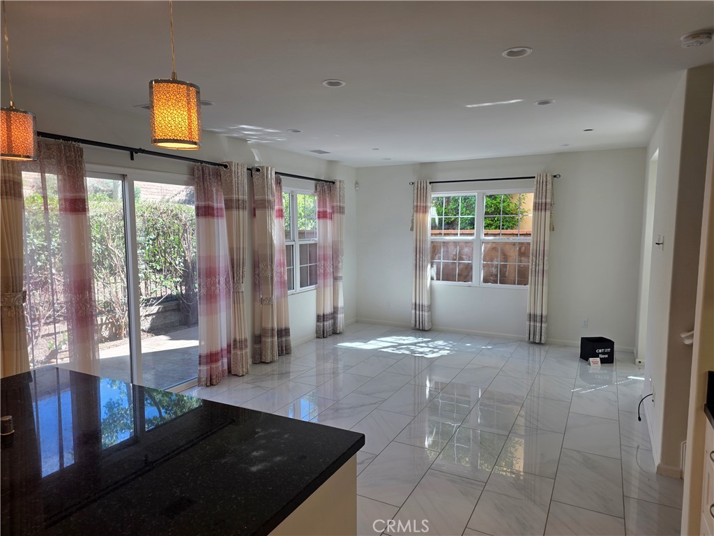 116 Firefly Irvine, CA 92618 - Photo 3 of 16 a view of an entryway with wooden floor and door
