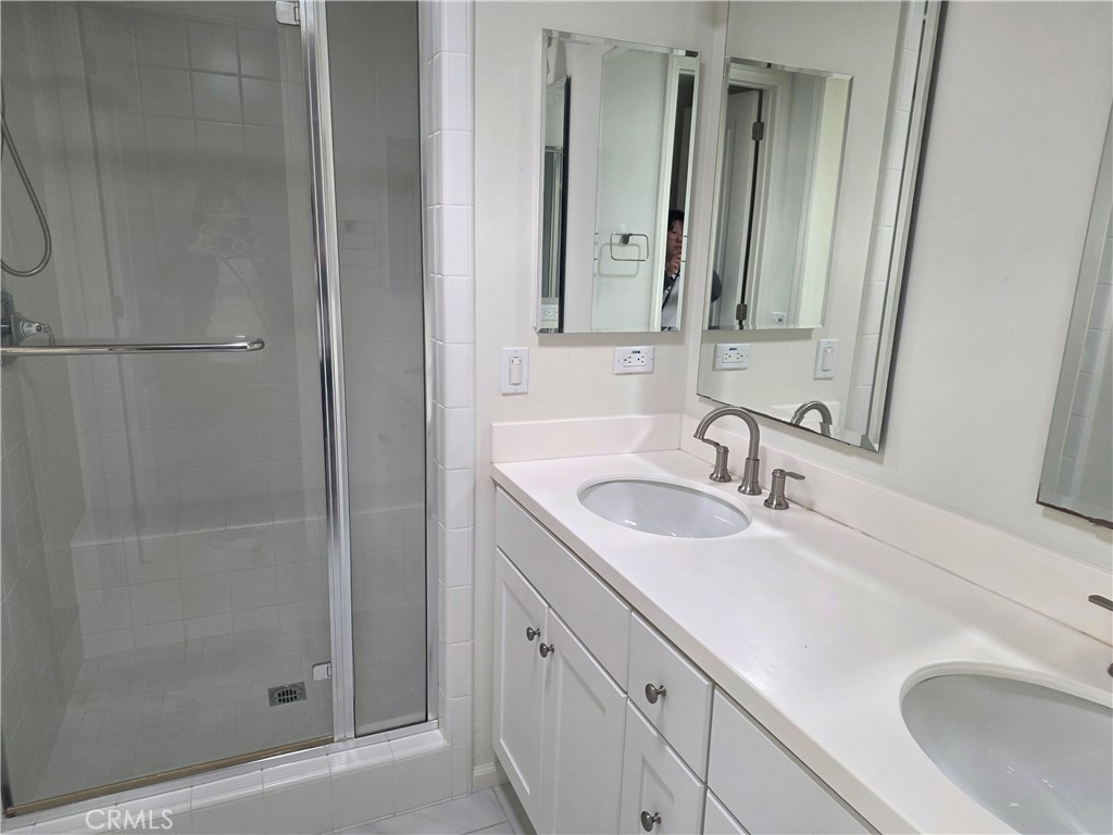 116 Firefly Irvine, CA 92618 - Photo 9 of 16 a bathroom with a sink and a mirror