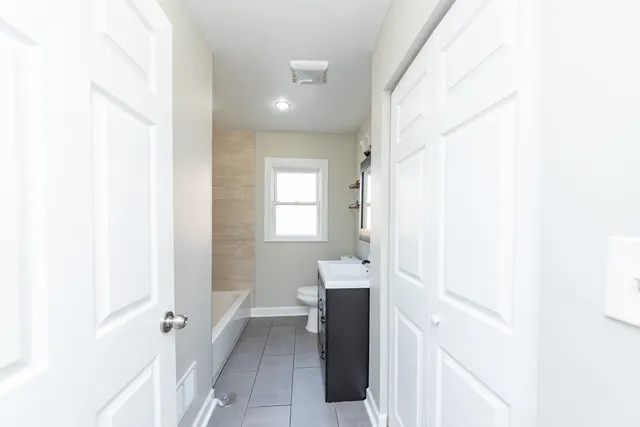 a bathroom with a sink and mirror