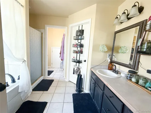 a white toilet sitting next to a bathroom sink and vanity