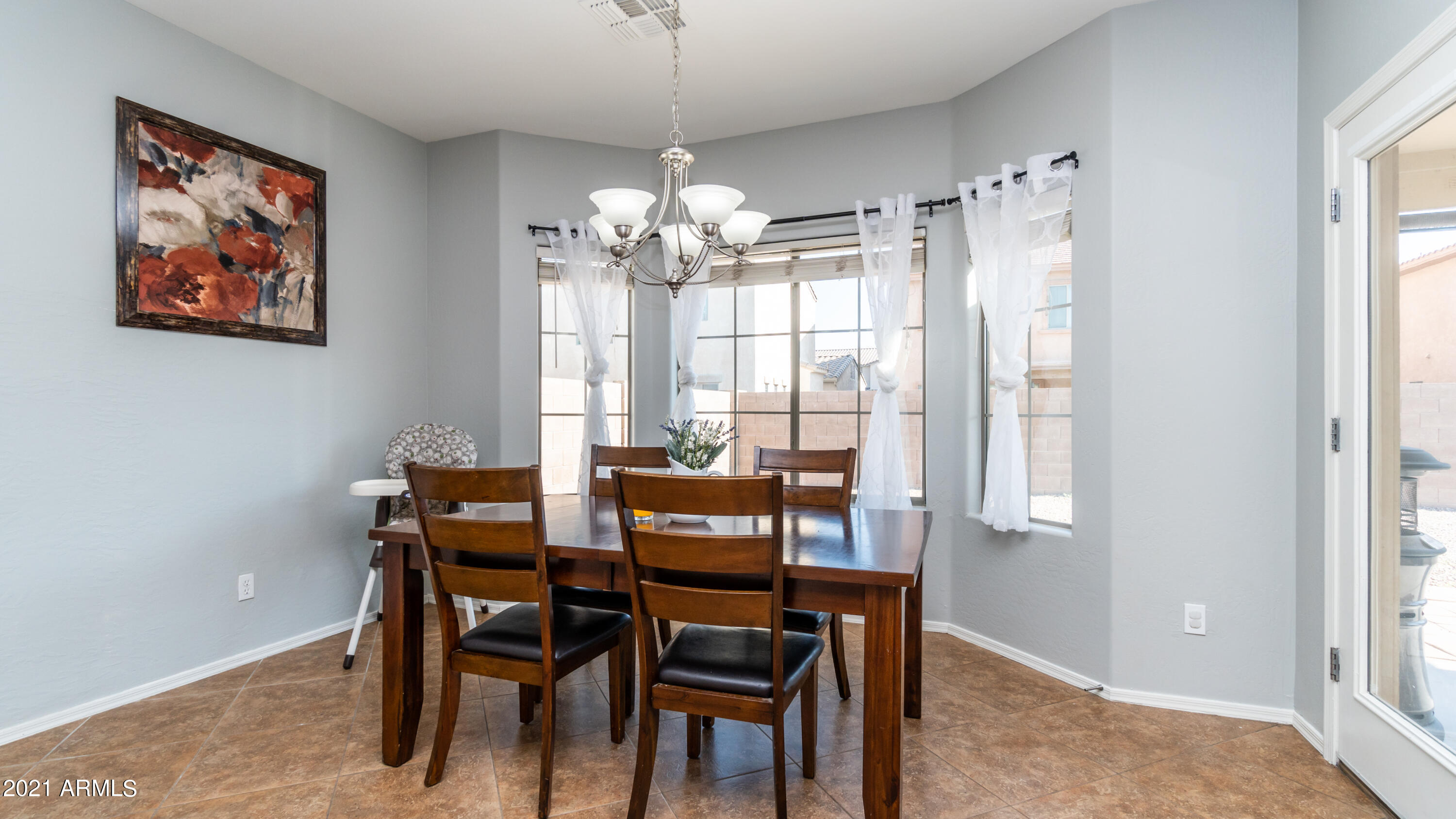45417 West Zion Road Maricopa, AZ 85139 - Photo 14 of 31 a view of a dining room with furniture window and outside view