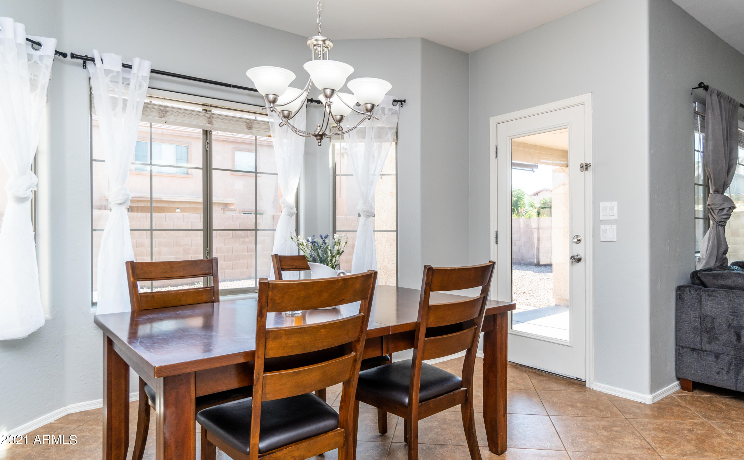 45417 West Zion Road Maricopa, AZ 85139 - Photo 15 of 31 a dining room with furniture and window