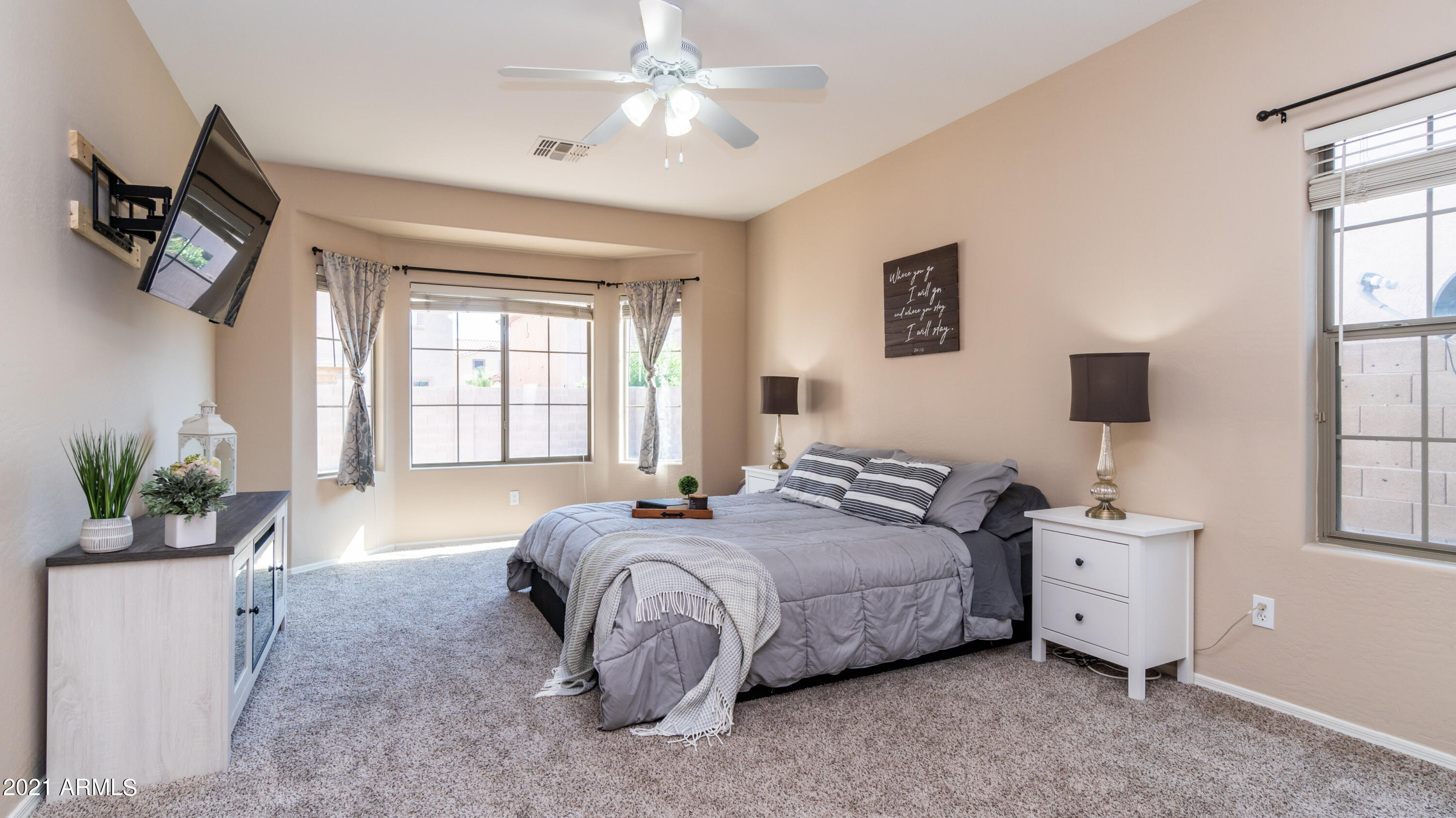 45417 West Zion Road Maricopa, AZ 85139 - Photo 17 of 31 a spacious bedroom with a bed and a window
