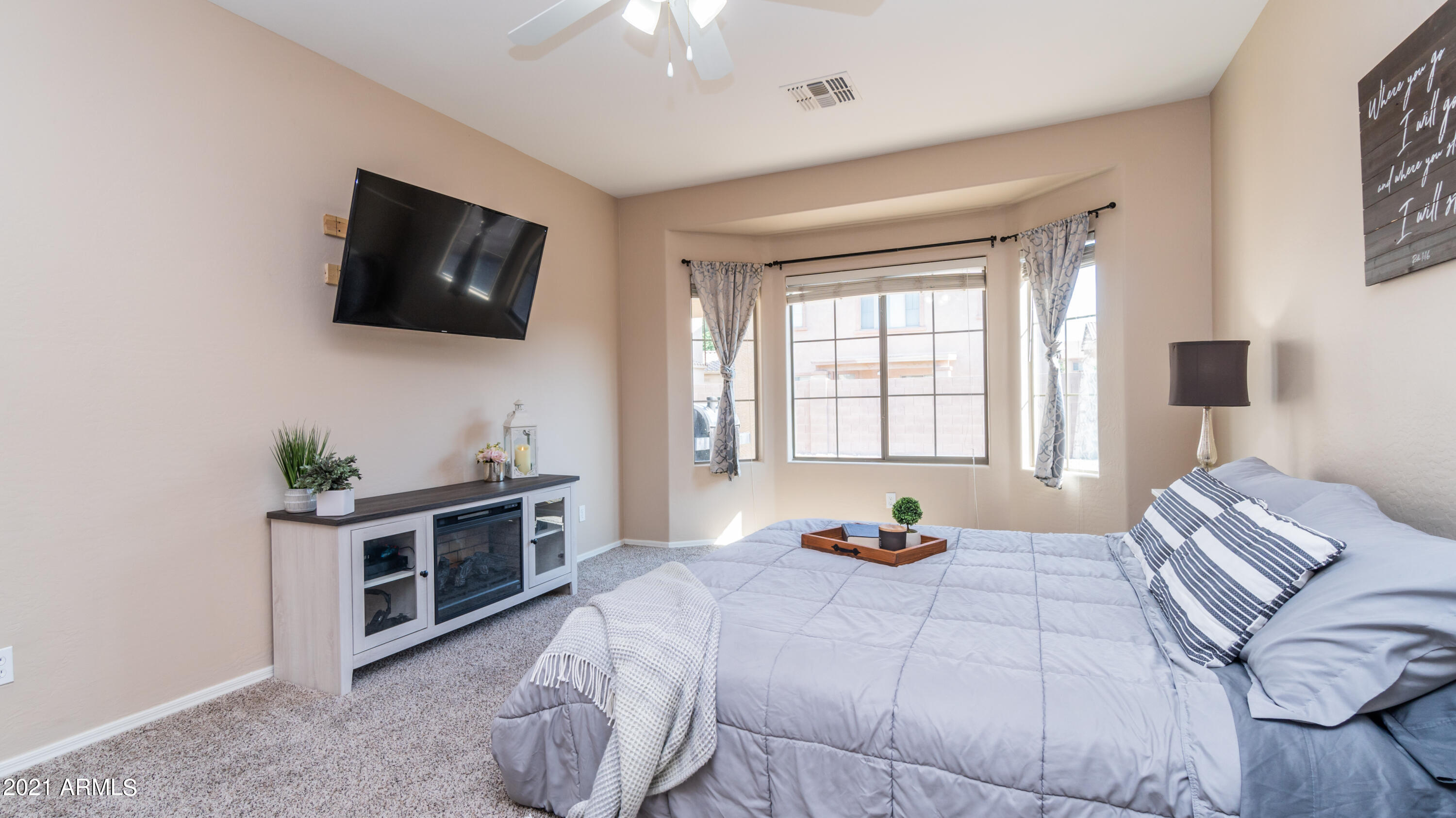 45417 West Zion Road Maricopa, AZ 85139 - Photo 18 of 31 a bedroom with a bed and a television