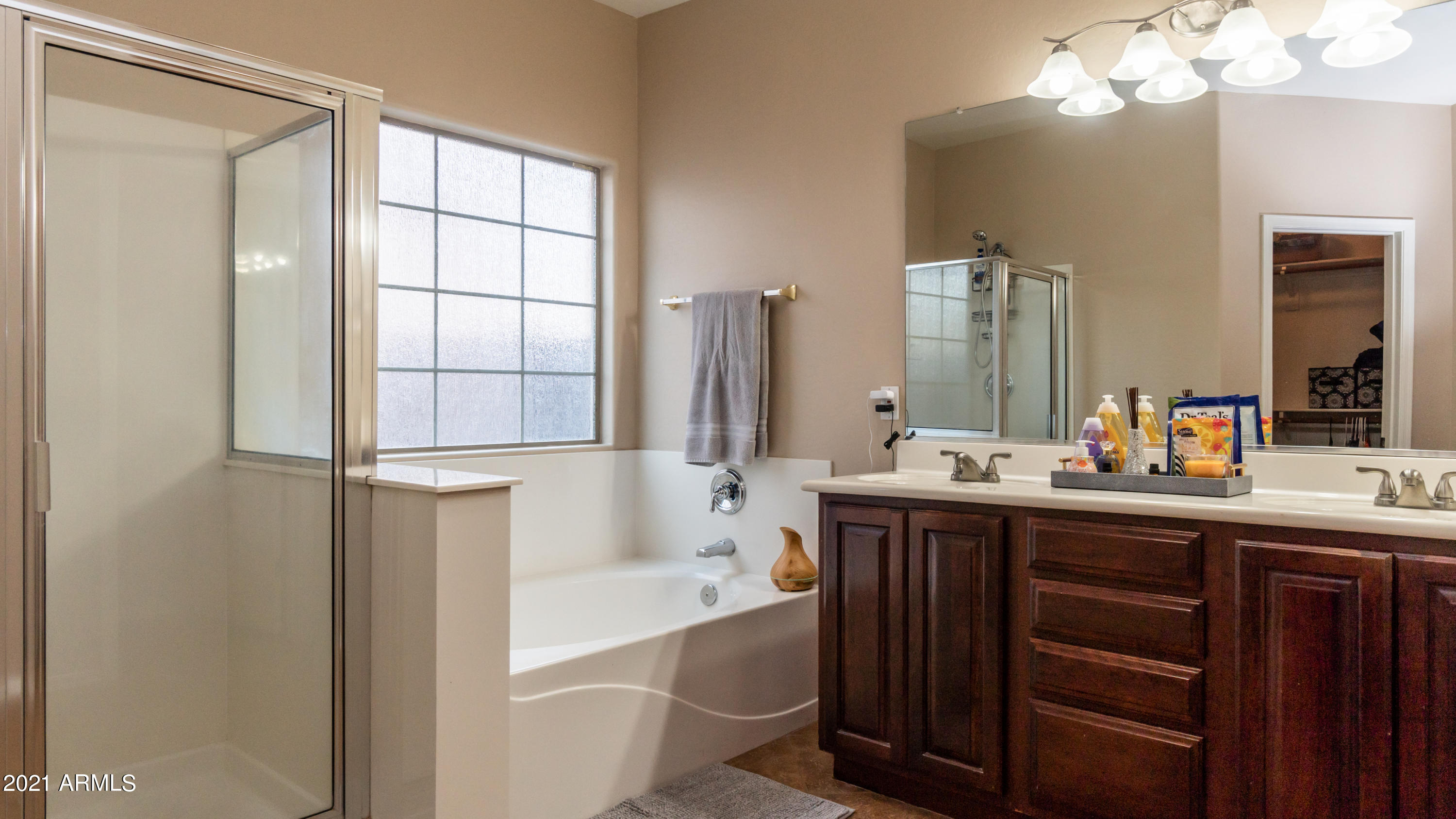 45417 West Zion Road Maricopa, AZ 85139 - Photo 20 of 31 a bathroom with a tub sink and mirror
