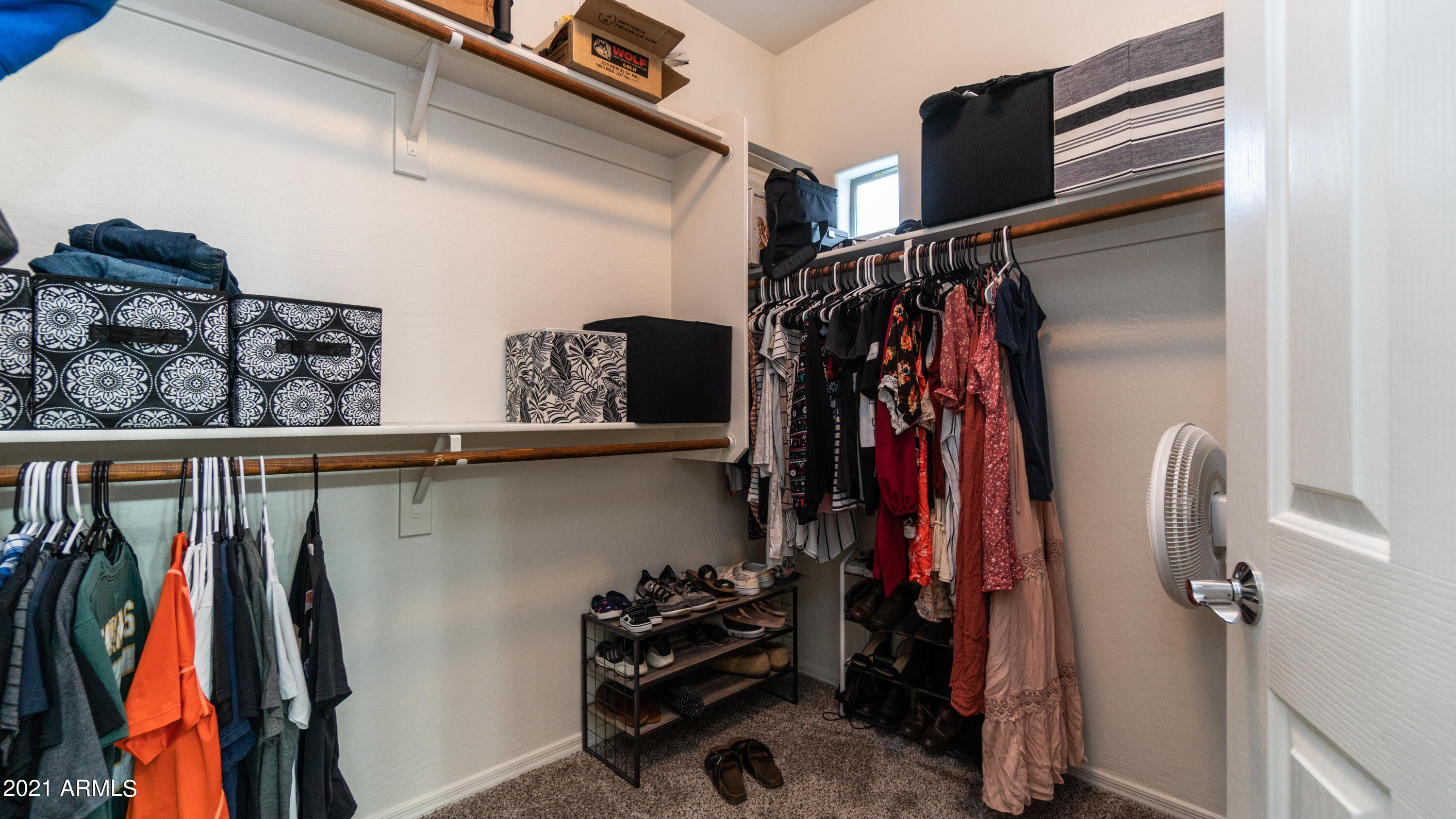 45417 West Zion Road Maricopa, AZ 85139 - Photo 23 of 31 a view of walk in closet with clothes and shoes