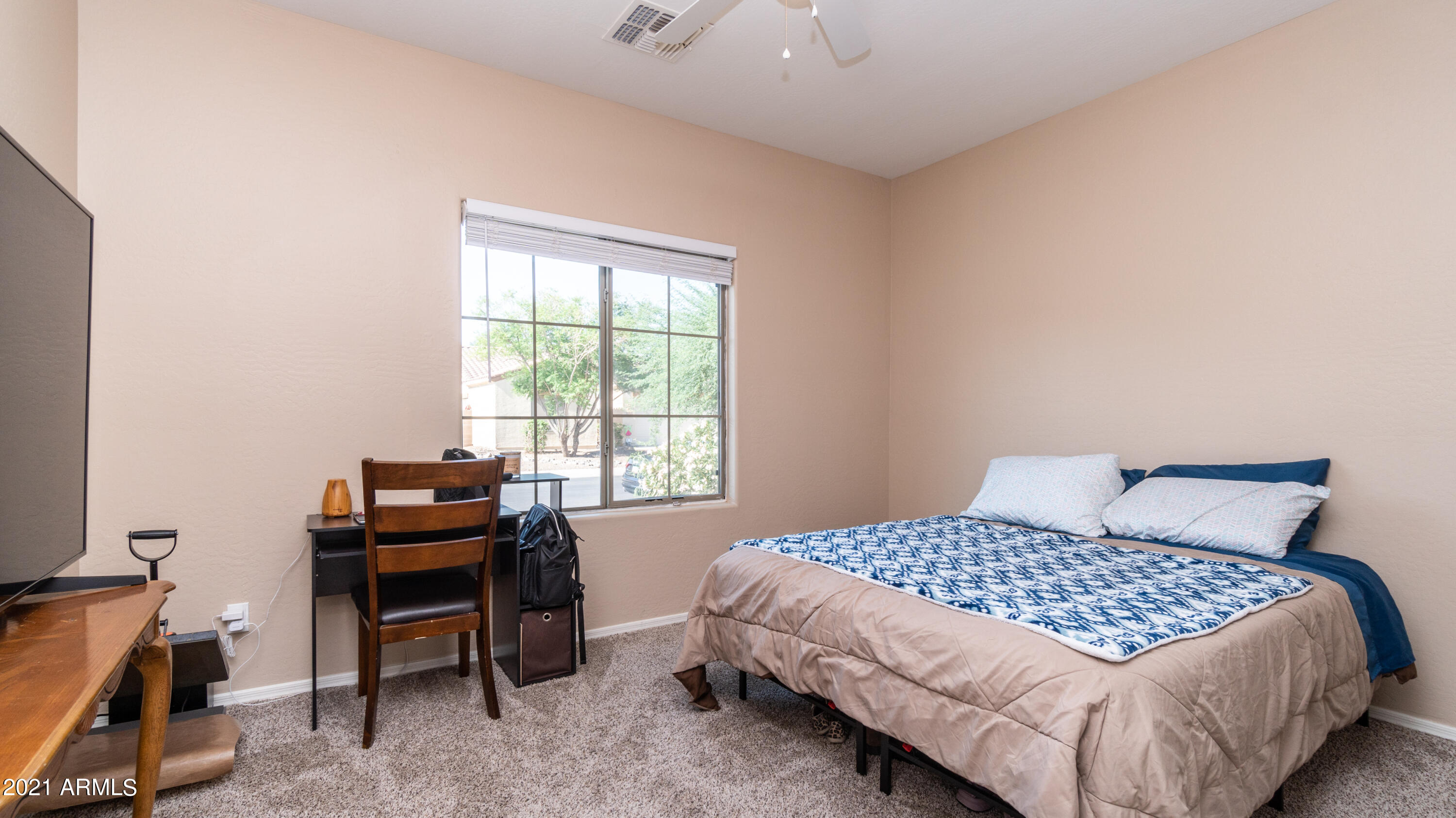 45417 West Zion Road Maricopa, AZ 85139 - Photo 25 of 31 a bedroom with a bed and a desk