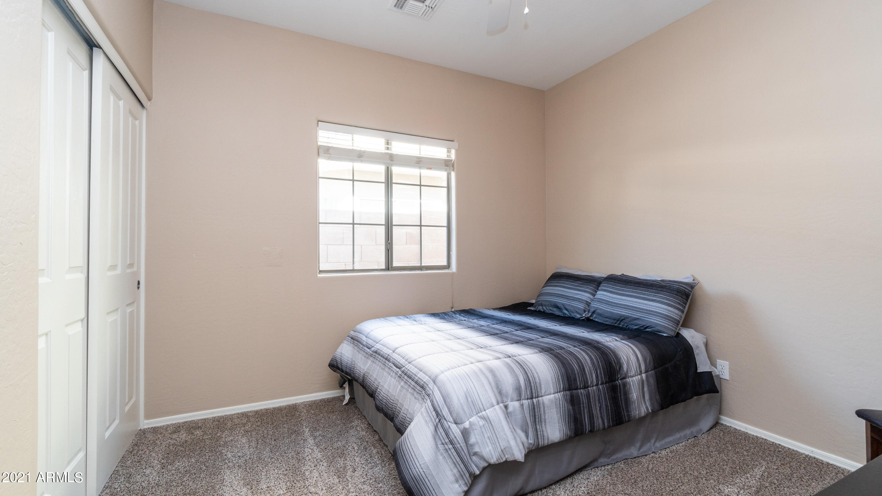 45417 West Zion Road Maricopa, AZ 85139 - Photo 26 of 31 a bedroom with a bed and window