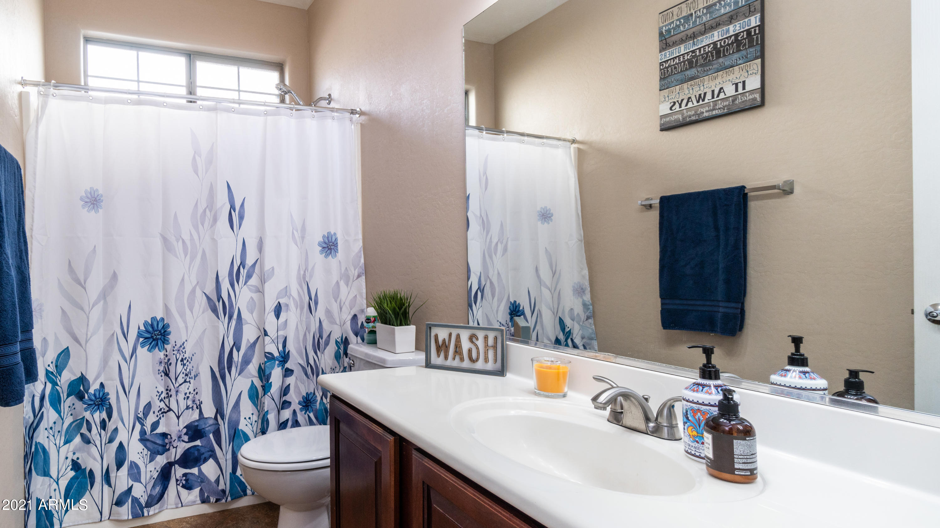 45417 West Zion Road Maricopa, AZ 85139 - Photo 27 of 31 a bathroom with a sink and a mirror