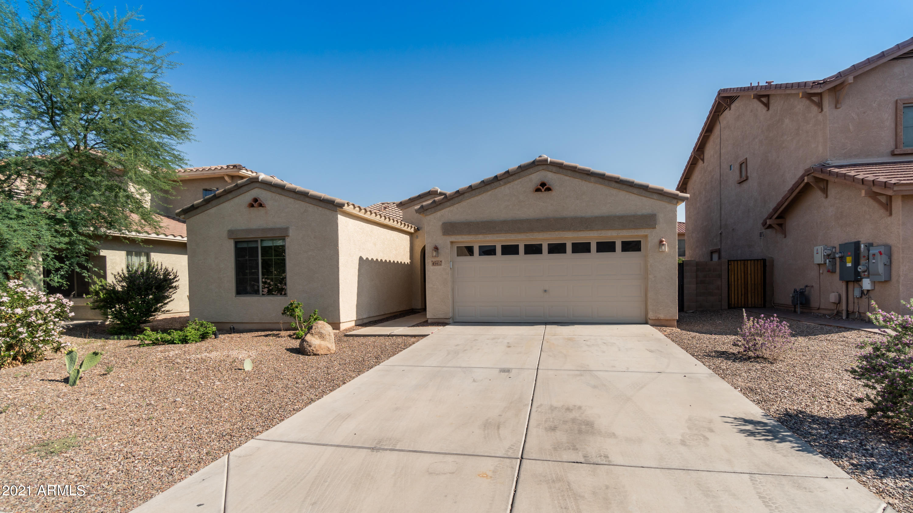 45417 West Zion Road Maricopa, AZ 85139 - Photo 3 of 31 a front view of a house with a yard