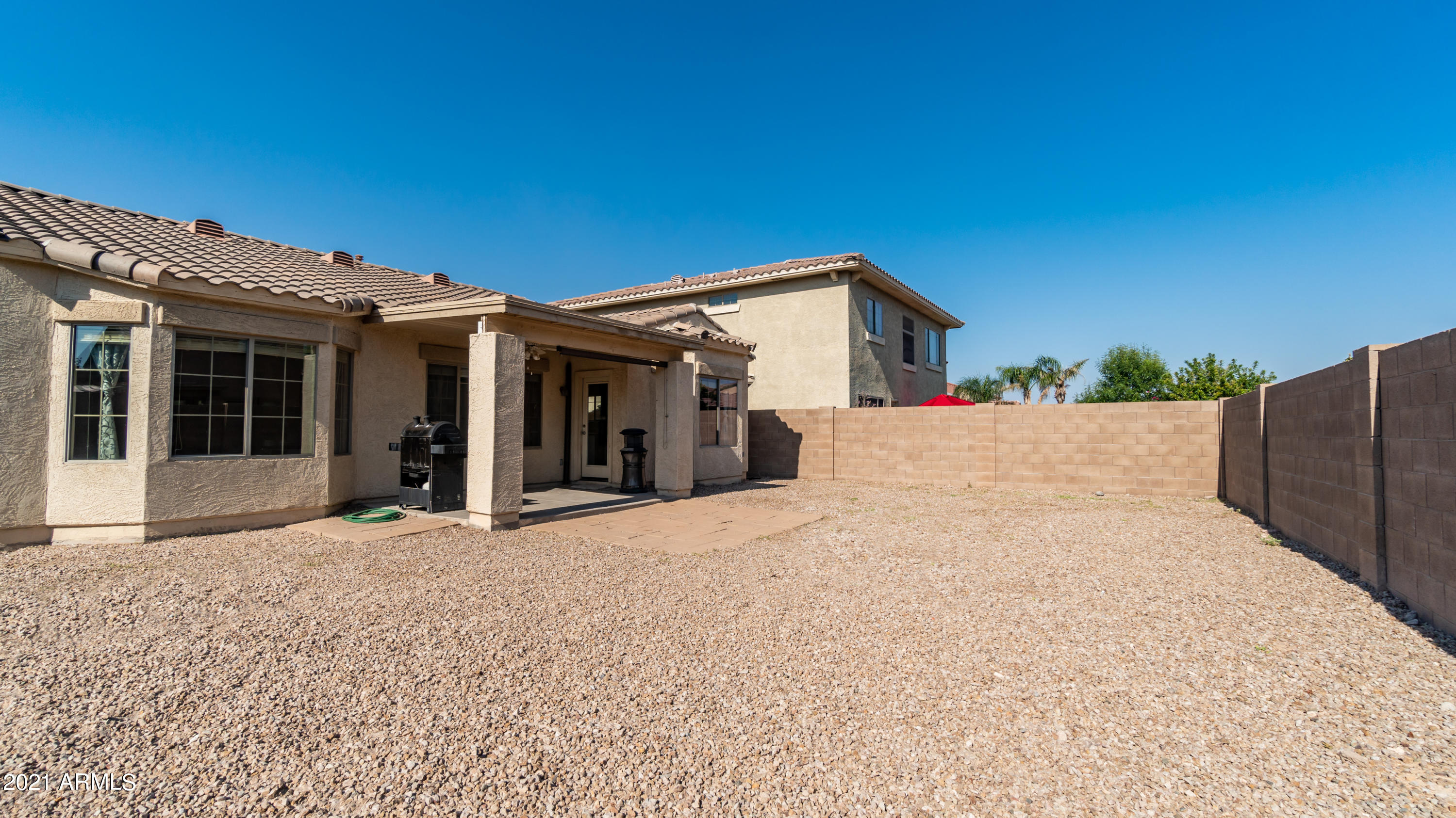 45417 West Zion Road Maricopa, AZ 85139 - Photo 31 of 31 a view of a house with a backyard