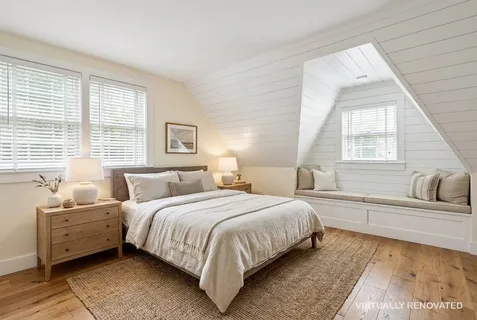 a bedroom with a large bed and a couch