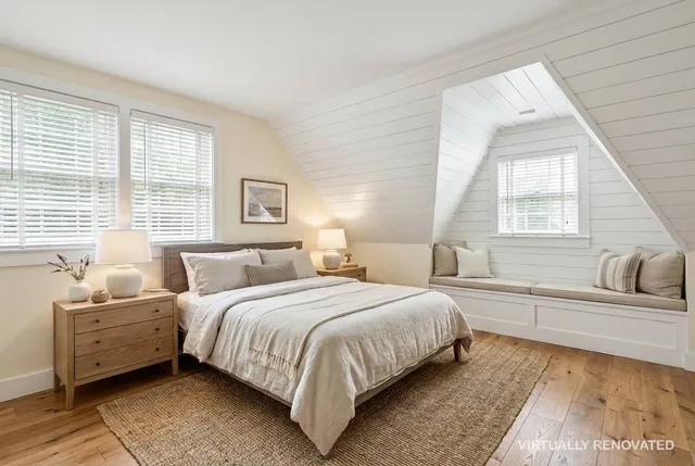 a bedroom with a large bed and a couch