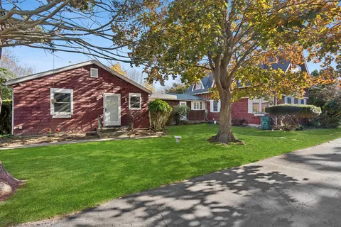 a front view of a house with garden