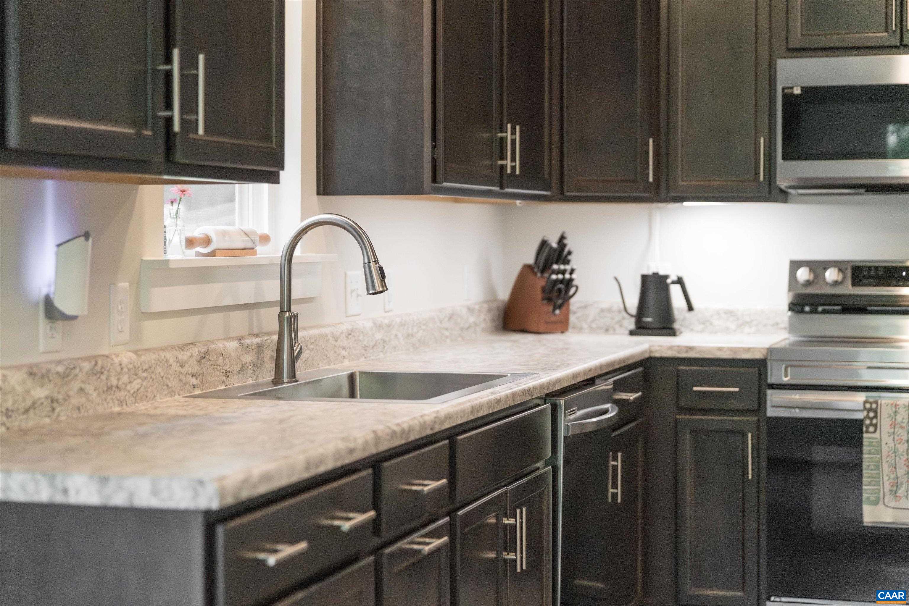 6 Kingswood Road Palmyra, VA 22963 - Photo 13 of 41 a kitchen with granite countertop a sink and cabinets