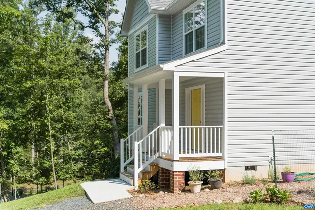 a view of a brick house with a large windows