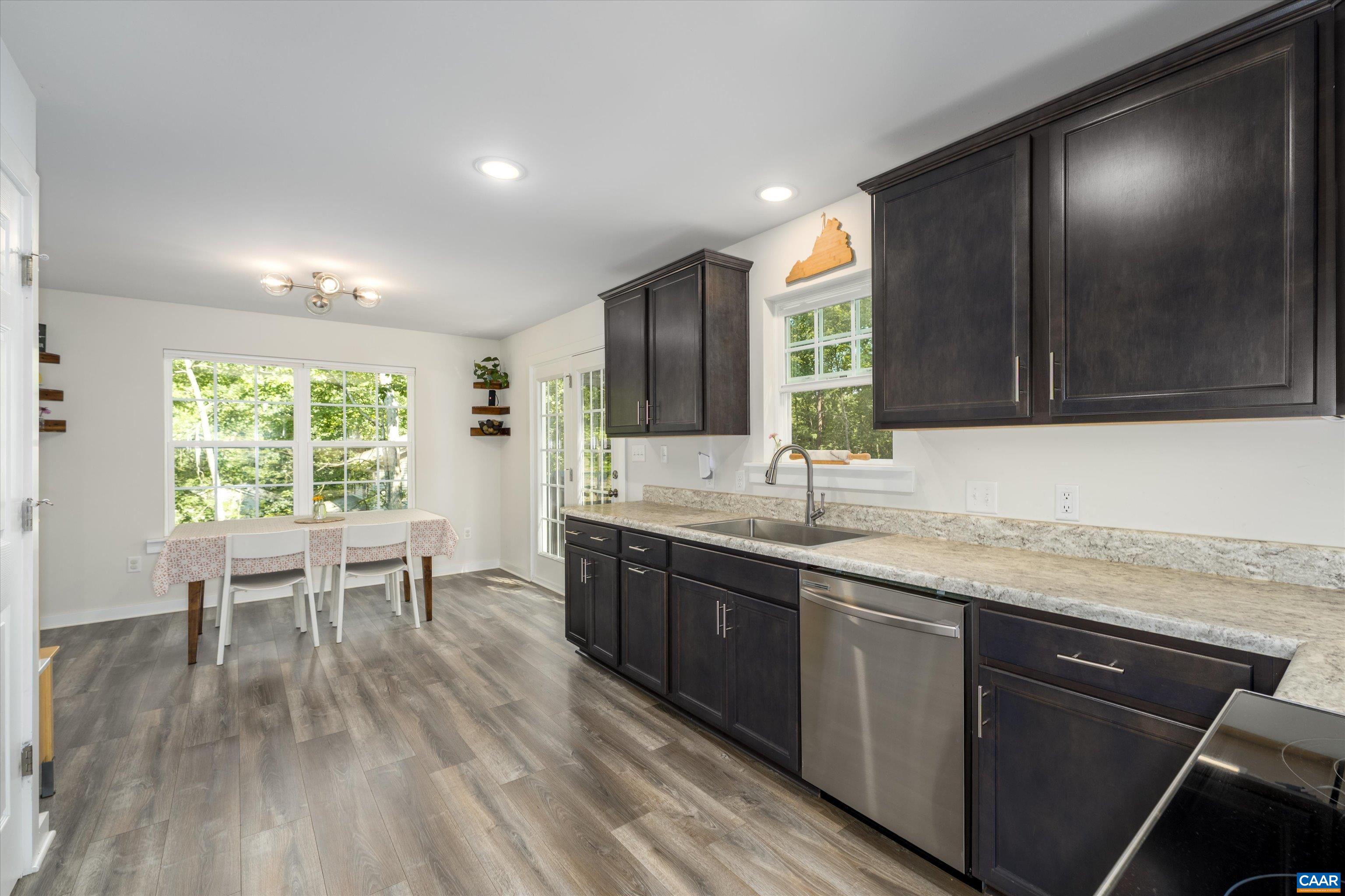 6 Kingswood Road Palmyra, VA 22963 - Photo 19 of 41 a kitchen with a sink and wooden cabinets