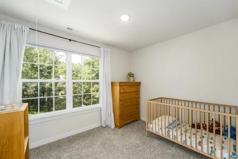 a view of a room with furniture and windows