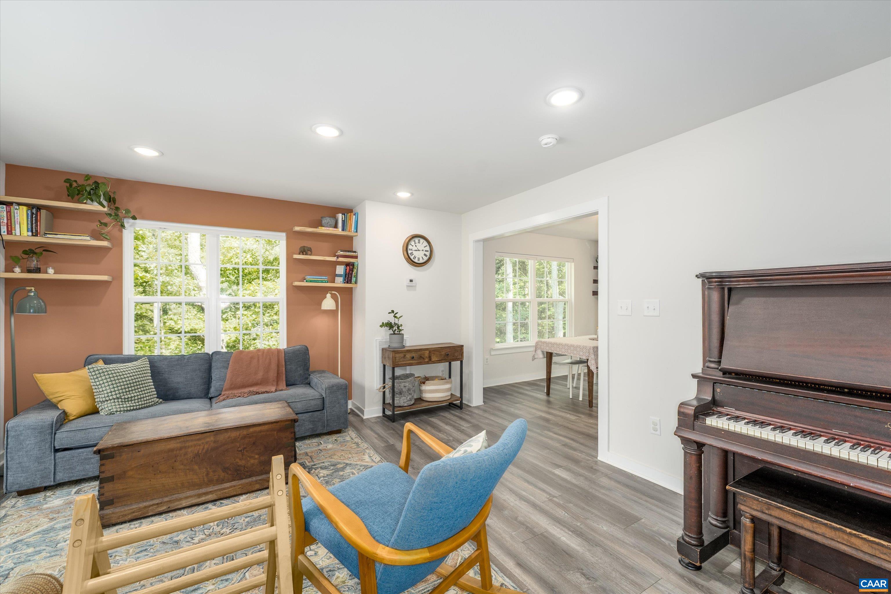 6 Kingswood Road Palmyra, VA 22963 - Photo 7 of 41 a living room with furniture a flat screen tv and a large window
