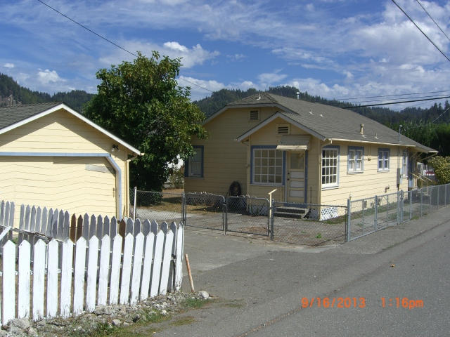 110 Ash Street Rio Dell, CA 95562 - Photo 1 of 1 a front view of a house with a garage