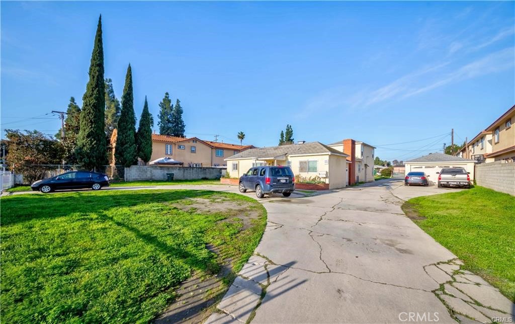 10987 Wright Road Lynwood, CA 90262 - Photo 1 of 1 a front view of a house with garden
