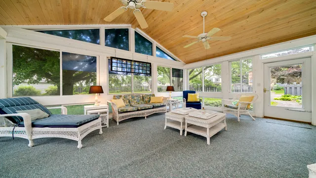a kitchen with granite countertop wooden cabinets and white appliances